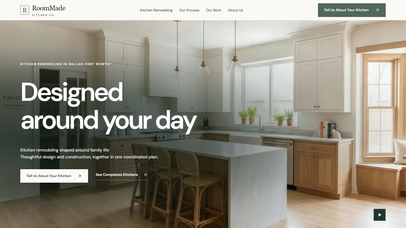 RoomMade Kitchen Co. website hero showing a bright kitchen with a central island and timber cabinetry.